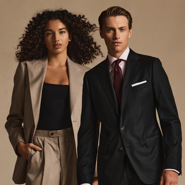 Three people wearing InStitchu custom tailoring