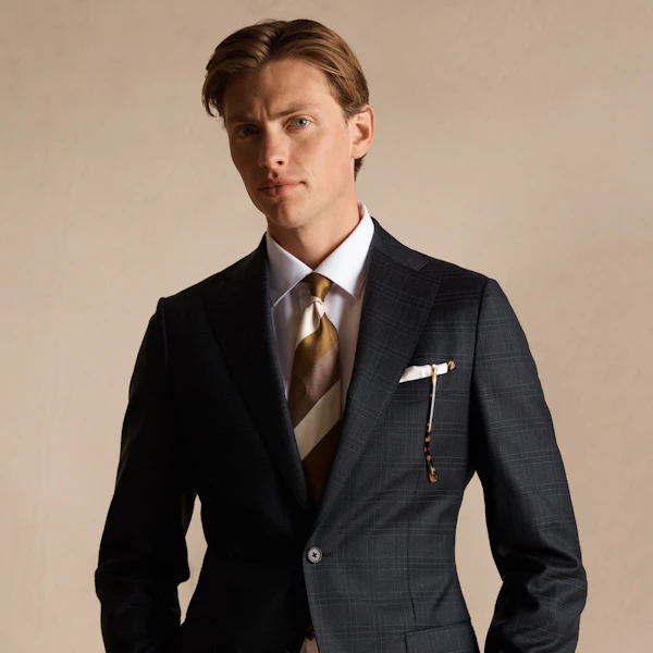 A man wearing a custom tailored InStitchu suit