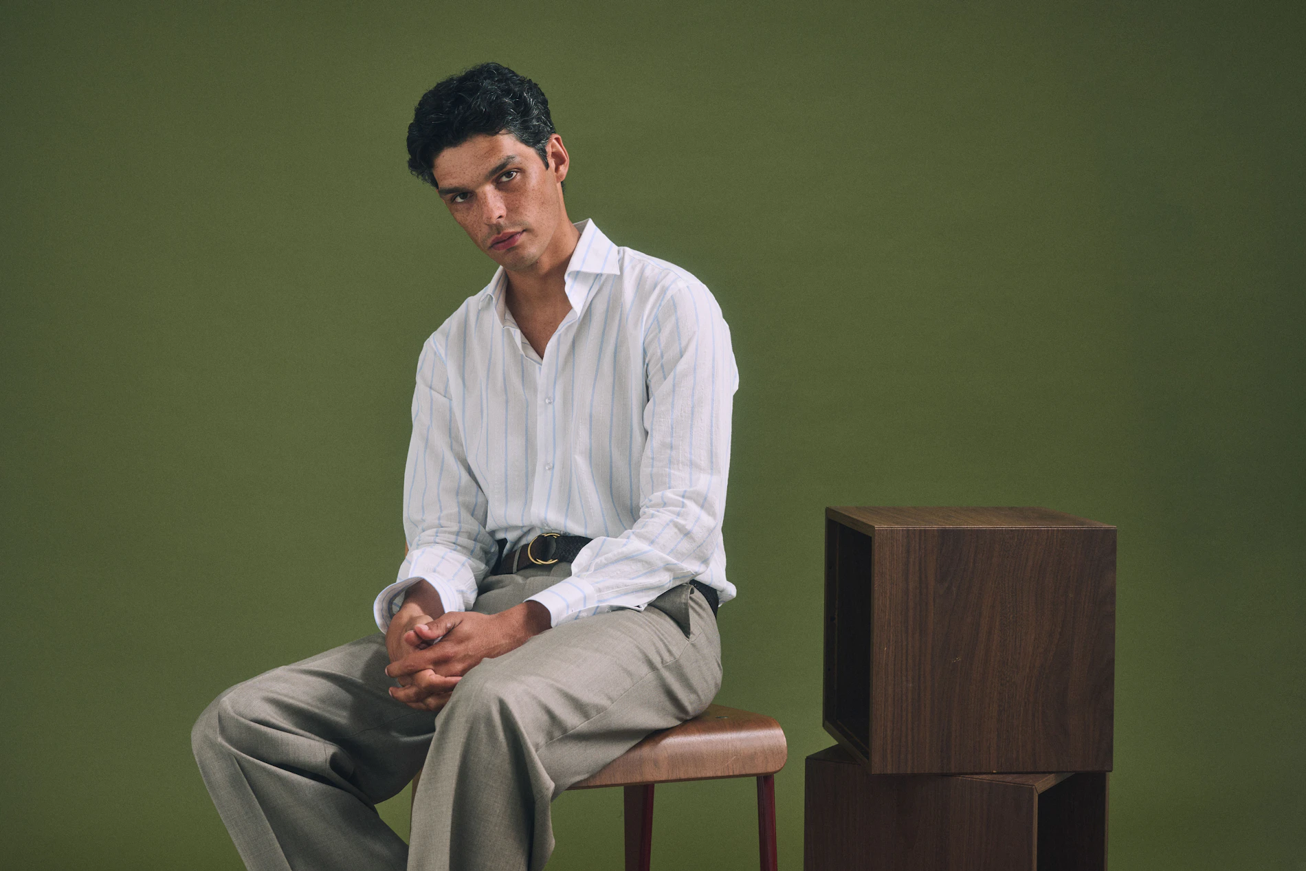 The Monterosa Loro Piana stone wool pants worn with an open white shirt