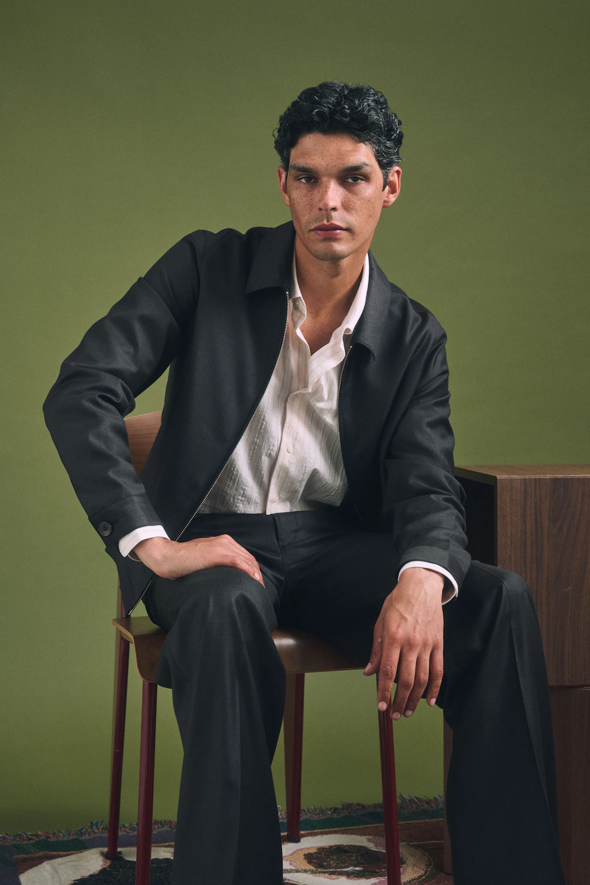 The Torino Loro Piana brown zip jacket and pants worn seated