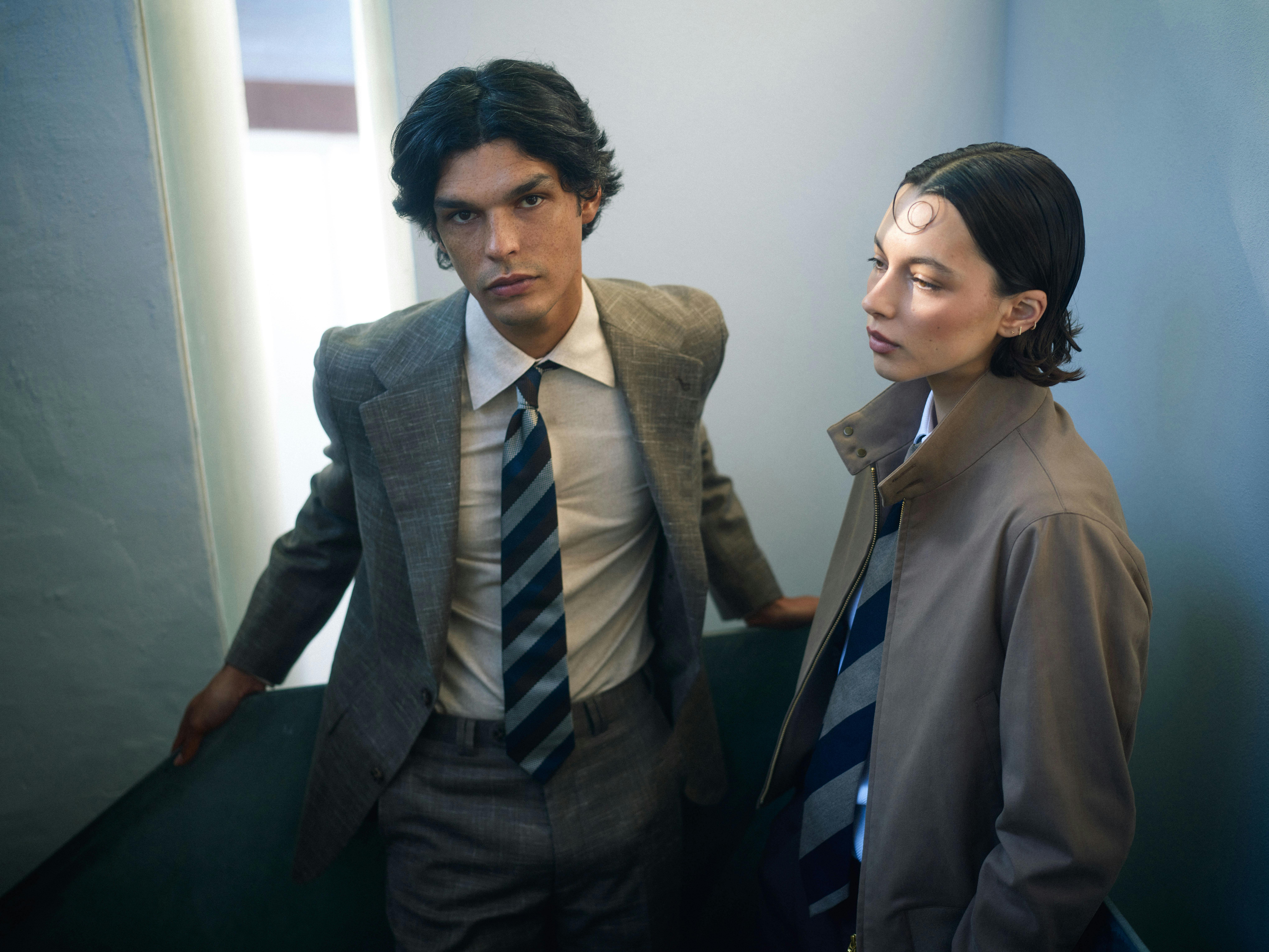 Two men in tailored looks — the Jeju Summer Suit and the Stephanie Cotton Bomber Jacket
