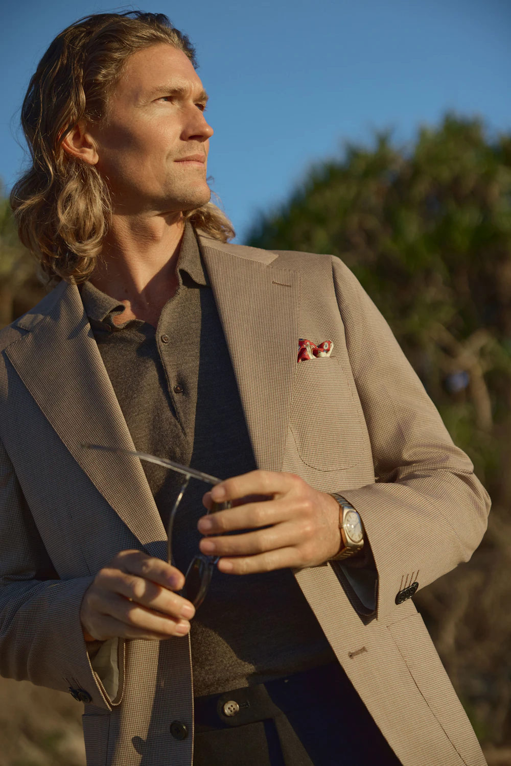 The Devonport taupe wool jacket, worn by the coast