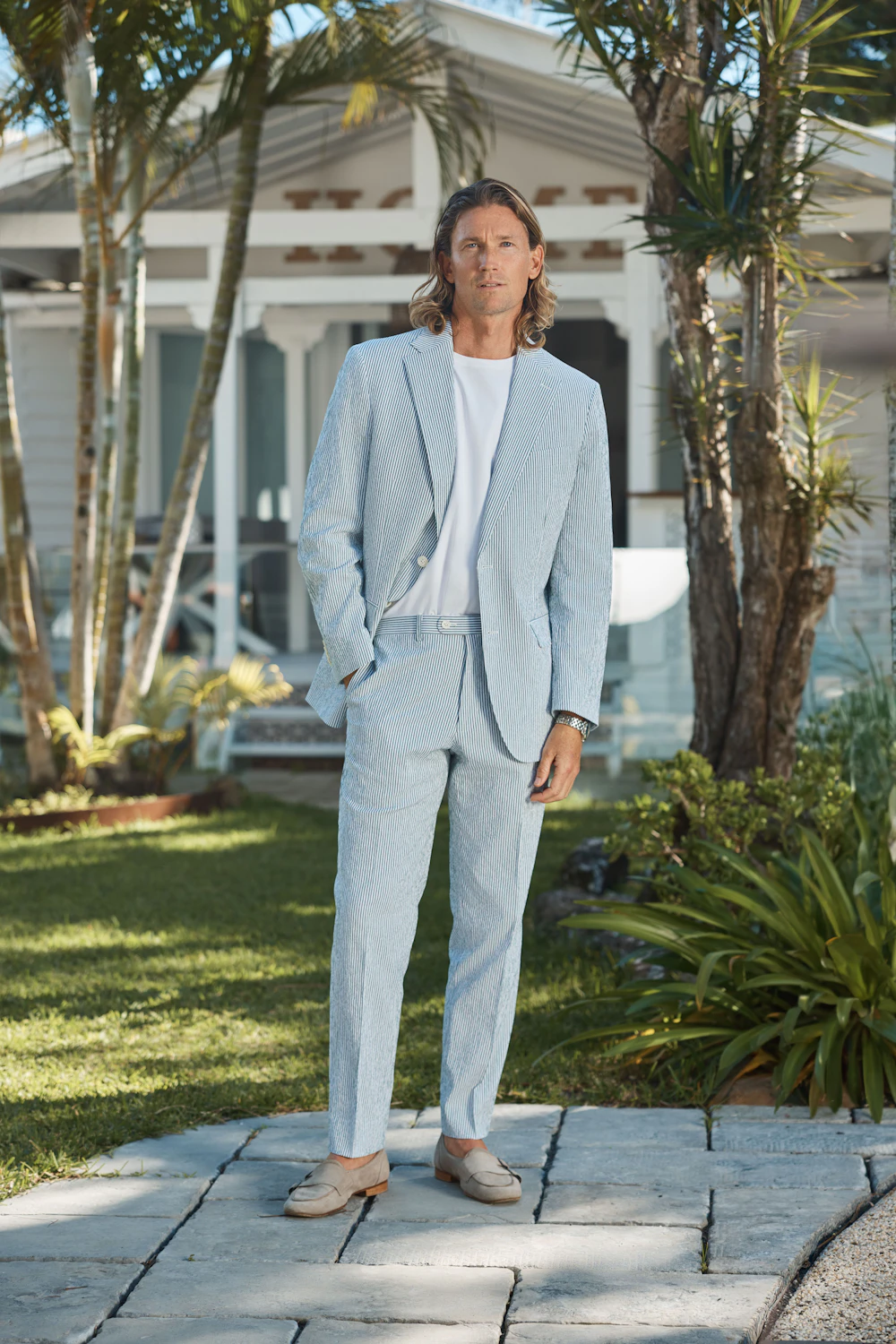 The Whyalla green seersucker suit, worn seated
